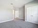 Comfortable bedroom with carpet flooring and closet access for ample storage at 2576 Pecan St, North Port, FL 34287