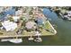 Waterfront property on a canal with a private dock, tropical landscaping, and boat access at 4446 Bahama Dr, Hernando Beach, FL 34607