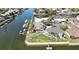 Waterfront property with lush landscaping, a private dock, and canal access for boating enthusiasts at 4446 Bahama Dr, Hernando Beach, FL 34607