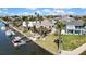 Waterfront property with mature landscaping, a private dock, and direct access to the canal at 4446 Bahama Dr, Hernando Beach, FL 34607