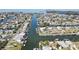 Scenic aerial view of a waterfront community with canals and homes at 4446 Bahama Dr, Hernando Beach, FL 34607