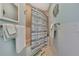Bathroom showcasing a bathtub, tiled walls, decorative mirror, and towel racks at 4446 Bahama Dr, Hernando Beach, FL 34607