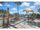 Waterfront deck with an umbrella-covered dining set, offering serene water views and outdoor relaxation at 4446 Bahama Dr, Hernando Beach, FL 34607