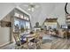 Bright dining area features a decorative ceiling fan, dining table, and a sliding door with water views at 4446 Bahama Dr, Hernando Beach, FL 34607
