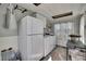 Convenient laundry room with a washer, dryer, and refrigerator for added functionality at 4446 Bahama Dr, Hernando Beach, FL 34607