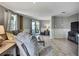 Comfortable living room features wood floors, a large sofa, and access to the backyard at 4446 Bahama Dr, Hernando Beach, FL 34607