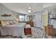 Bright bedroom featuring coastal decor, a ceiling fan, and hardwood floors, offering a relaxing retreat at 4446 Bahama Dr, Hernando Beach, FL 34607