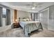 Cozy main bedroom with a comfortable bed, ceiling fan, and ample closet space at 4446 Bahama Dr, Hernando Beach, FL 34607