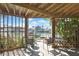 Inviting outdoor patio area with seating overlooking a scenic canal and boat docks at 4446 Bahama Dr, Hernando Beach, FL 34607