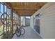 Covered patio area with bike parking and sliding door access to the interior at 4446 Bahama Dr, Hernando Beach, FL 34607