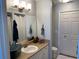 Bathroom featuring a sink, vanity, large mirror, and modern lighting fixture at 5520 Rosehill Rd # 201, Sarasota, FL 34233