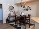 Stylish dining area featuring modern lighting, elegant decor, and a chic area rug at 5520 Rosehill Rd # 201, Sarasota, FL 34233