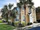Two-story condo showcasing well-maintained landscaping and a welcoming front entrance at 5520 Rosehill Rd # 201, Sarasota, FL 34233