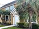 Inviting two-story condo showcasing well-maintained landscaping and a clean, white door at 5520 Rosehill Rd # 201, Sarasota, FL 34233