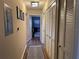 Hallway with stylish decor and a glimpse of the adjacent room at 5520 Rosehill Rd # 201, Sarasota, FL 34233
