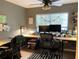 Brightly lit home office featuring a large window and two separate work areas at 5520 Rosehill Rd # 201, Sarasota, FL 34233
