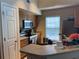 Kitchen featuring stainless steel appliances, wood cabinets, and a functional layout at 5520 Rosehill Rd # 201, Sarasota, FL 34233