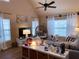 Bright living room with vaulted ceilings, multiple windows, and stylish decor at 5520 Rosehill Rd # 201, Sarasota, FL 34233