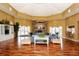 Inviting community lobby with comfortable seating, fireplace, and light hardwood flooring at 5520 Rosehill Rd # 201, Sarasota, FL 34233