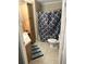 Bathroom with neutral tile, stand up shower and wood cabinet at 4939 Marina Palms Dr, Port Richey, FL 34668