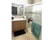Bathroom featuring a vanity sink and combination shower and tub at 4939 Marina Palms Dr, Port Richey, FL 34668