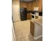 Functional kitchen with stainless steel refrigerator and white appliances at 4939 Marina Palms Dr, Port Richey, FL 34668