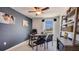 Comfortable home office featuring a sleek desk, modern chairs, and a built-in bookshelf for organization at 30934 Silver Stage Dr, Brooksville, FL 34602