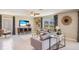 Inviting living room with stylish decor, comfortable seating, decorative curtains, and plenty of natural light at 30934 Silver Stage Dr, Brooksville, FL 34602
