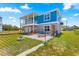 Backyard featuring a small outdoor tub, fenced yard, and outdoor seating area at 6771 Seaview Blvd, Hudson, FL 34667