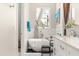Chic bathroom with a soaking tub, decorative rocks, and stylish fixtures at 6771 Seaview Blvd, Hudson, FL 34667