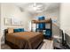 Cozy bedroom featuring a bed and bunk bed, ceiling fan, and wood-look flooring at 6771 Seaview Blvd, Hudson, FL 34667