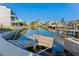 View of the boat dock and canal from the property, with damaged landing at 6771 Seaview Blvd, Hudson, FL 34667