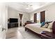 Spacious main bedroom featuring wood-look floors, sitting area and ample natural light at 6771 Seaview Blvd, Hudson, FL 34667