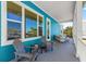 Inviting outdoor porch with comfortable seating, offering a relaxing spot with serene views at 6771 Seaview Blvd, Hudson, FL 34667