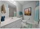 Bright bathroom with vanity, sink, toilet and a shower with a shower curtain at 17663 Turning Leaf Cir, Land O Lakes, FL 34638
