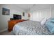 This bedroom features a closet, a window and an ensuite at 17663 Turning Leaf Cir, Land O Lakes, FL 34638