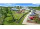Aerial view of community amenities, including a pool, playground, and parking area at 17663 Turning Leaf Cir, Land O Lakes, FL 34638