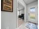 Bright entrance to the home office with a locking door and frosted glass at 17663 Turning Leaf Cir, Land O Lakes, FL 34638