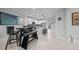 Open floor plan featuring a kitchen with stainless appliances and granite countertops connected to a casual dining area at 17663 Turning Leaf Cir, Land O Lakes, FL 34638