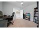 This is a home office featuring a ceiling fan, closet and window at 17663 Turning Leaf Cir, Land O Lakes, FL 34638