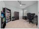 This is a home office featuring a ceiling fan, closet and window at 17663 Turning Leaf Cir, Land O Lakes, FL 34638