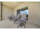 Cozy screened-in patio featuring comfortable seating, perfect for enjoying the outdoors in comfort at 17663 Turning Leaf Cir, Land O Lakes, FL 34638
