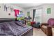 Neutral bedroom featuring desk area, window, and comfortable furnishings for relaxation and enjoyment at 4196 Hoffman Ave, Spring Hill, FL 34606