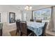Spacious dining area with natural light, views of the front door, and an adjacent living area at 4196 Hoffman Ave, Spring Hill, FL 34606