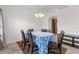 Bright dining area includes an elegant chandelier and views to the kitchen for easy serving at 4196 Hoffman Ave, Spring Hill, FL 34606