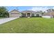 Charming single Gathering home featuring a spacious lawn, attached two car garage and mature landscaping at 4196 Hoffman Ave, Spring Hill, FL 34606
