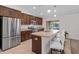 Modern kitchen with a large island, stainless steel appliances, and ample cabinetry at 4196 Hoffman Ave, Spring Hill, FL 34606
