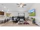 Spacious living room featuring a large sectional sofa and modern entertainment center at 4196 Hoffman Ave, Spring Hill, FL 34606