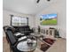 Cozy living room showcasing a large sectional sofa and mounted TV at 4196 Hoffman Ave, Spring Hill, FL 34606