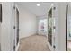 Bright home office with carpet, transom window and stylish glass paneled double doors at 4196 Hoffman Ave, Spring Hill, FL 34606